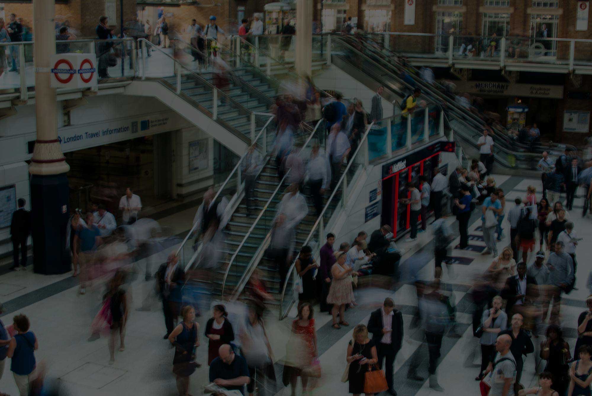 Many people in a mall accessing the wireless network