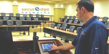 SecurEdge-engineer-working-in-large-conference-room